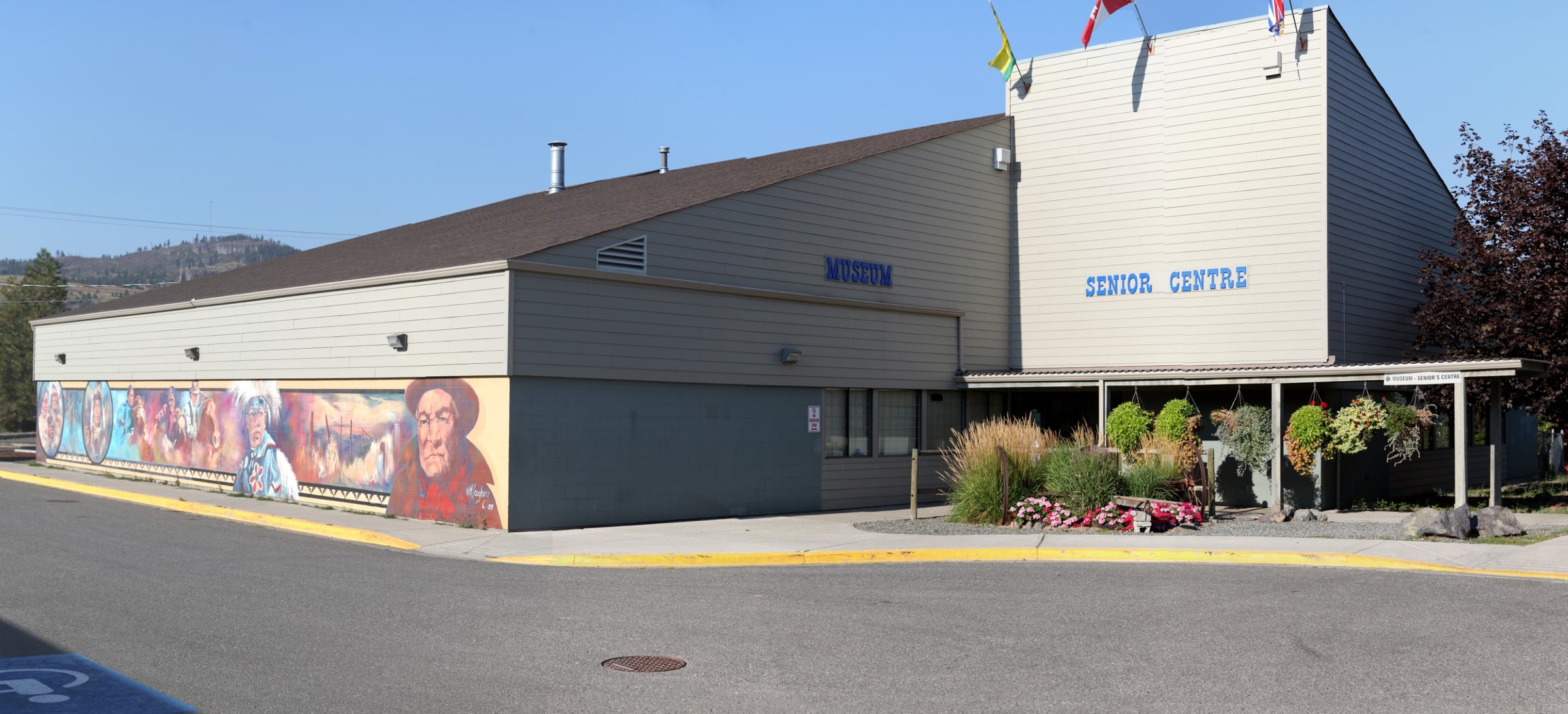 The Nicola Valley Museum & Archives building at 1675 Tutill Court, Merritt, with its murals
