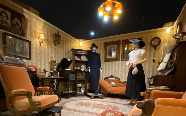 Parlour display with costumed figures